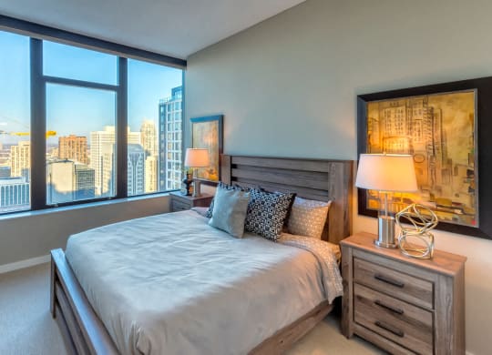 Nic on 5th Apartments in Minneapolis, Minnesota-  large bedroom with tall ceilings and Downtown West Minneapolis city views