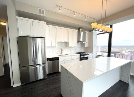 Nic on 5th Apartments- The Olivia floorplan with marble granite countertops, great lighting design and views of Downtown West Minneapolis