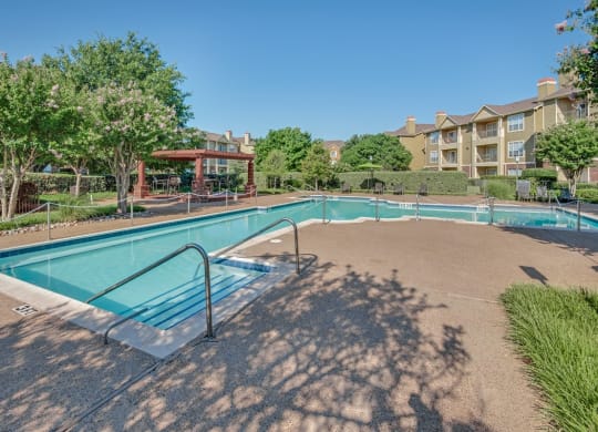 the preserve at ballantyne commons community pool and hot tub with apartment buildings in the background