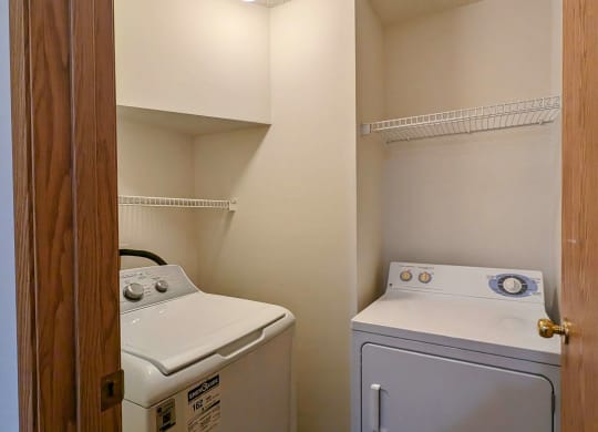 a laundry room with a washer and dryer in it