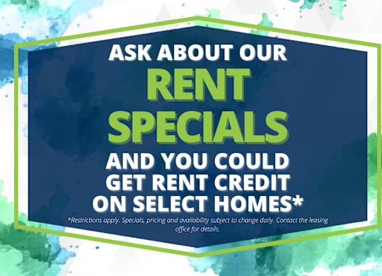 A sign advertising rent specials and potential rent credit on select homes.