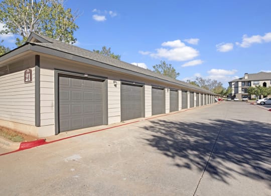 a row of garages in front of a house