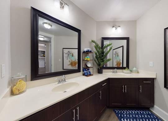 A bathroom with a sink, mirror, and a rug.