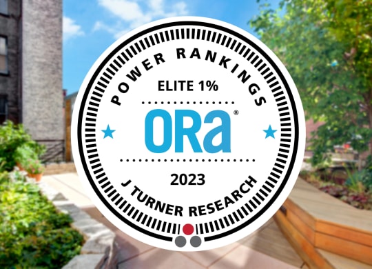 an image of the ora logo with a backyard with trees