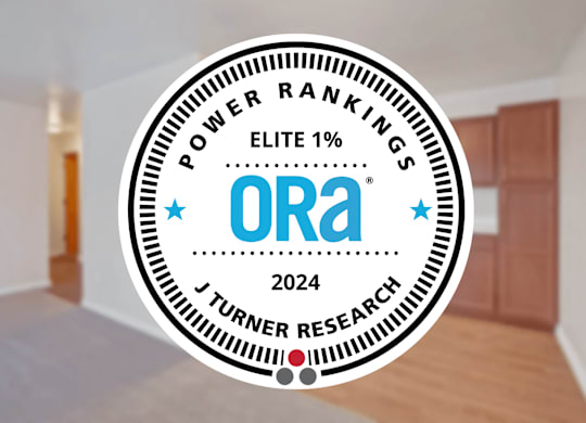 A badge with the text "POWER RANKINGS ELITE 1%" and "ORA 2024" is superimposed on an image of a room.