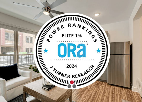 A round badge with the text "POWER RANKINGS ELITE 1% Ora 2024 J TURNER RESEARCH".