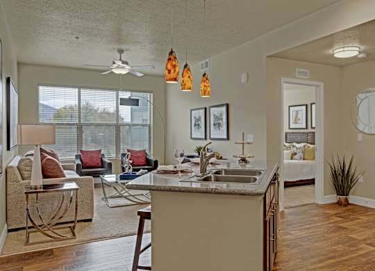 A kitchen with a dining table and chairs.