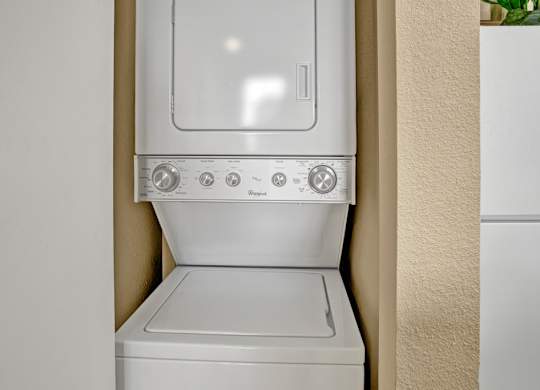 A white dishwasher is installed in a kitchen.