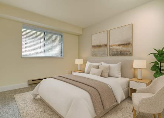 A serene bedroom here at Forest Greens featuring beige carpet and soft neutral walls, styled with a queen bed dressed in white bedding, layered neutral pillows, and a textured throw. Matching bedside tables with lamps flank the bed, abstract wall art hangs above the headboard, and a window with blinds brings in natural light.