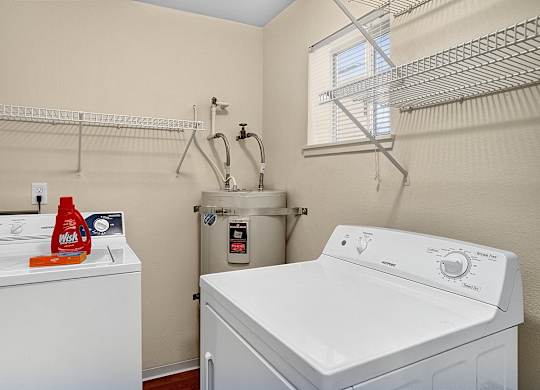 A laundry room with a washer and dryer.