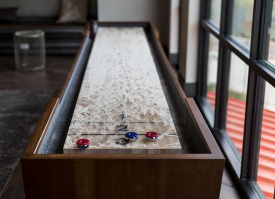 a ping pong table in the living room of a house