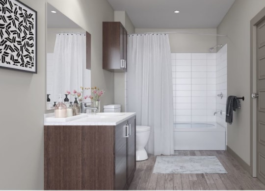 Modern bathroom here at 49 West Apartments with dark wood cabinets, large mirror, and white counter. Floral decor on the counter. White shower curtain and subway tiles in the shower.