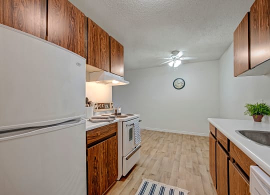 Cambridge West Kitchen Dark Cabinets White Appliances Apartments for rent in Edmonton, AB