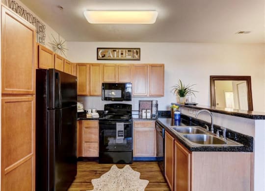 Residence at North Penn living room with hardwood flooring and granite countertops
