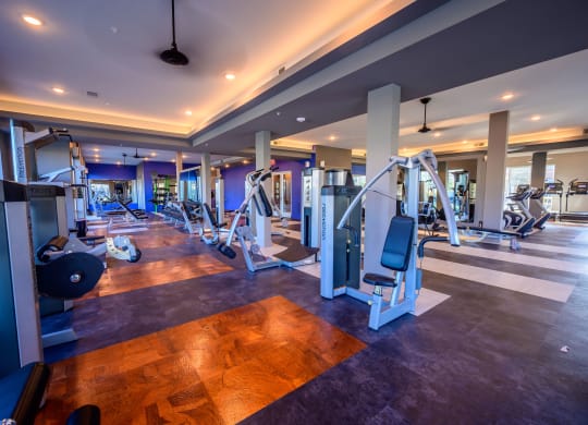 Harmony Luxury Apartments fitness room with equipment Apartment near Garland,  TX