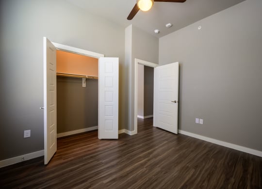 Harmony Luxury Apartments bedroom with tall ceilings and natural lighting