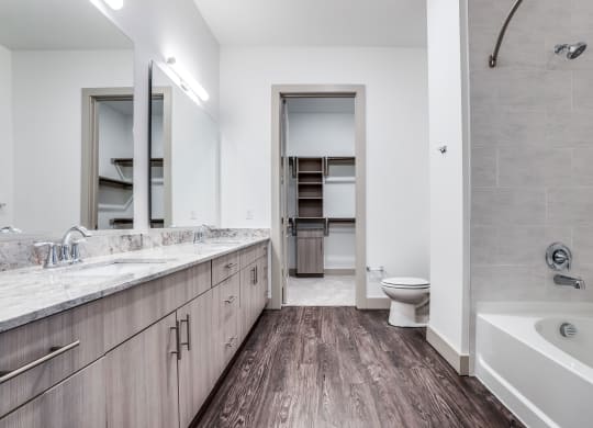 The Crosby at The Brickyard large bathroom with wooden floors Dallas Texas Apartment