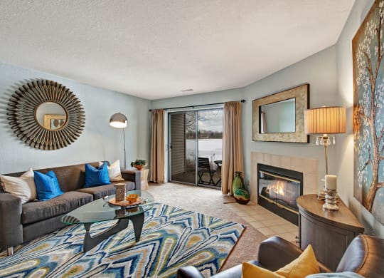 River's Cove living room with fireplaceoffer a living room with a fireplace