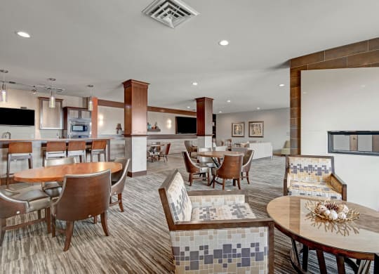 The Clubhouse at The Vue at Pinnacle Peak Apartment Homes Apartments in Fitchburg, WIed with furniture and a large window