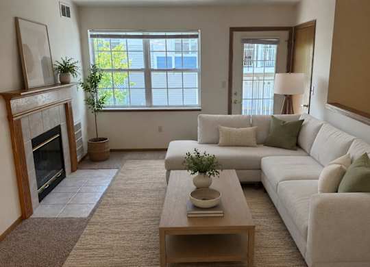 A living room with a fireplace and a couch.
