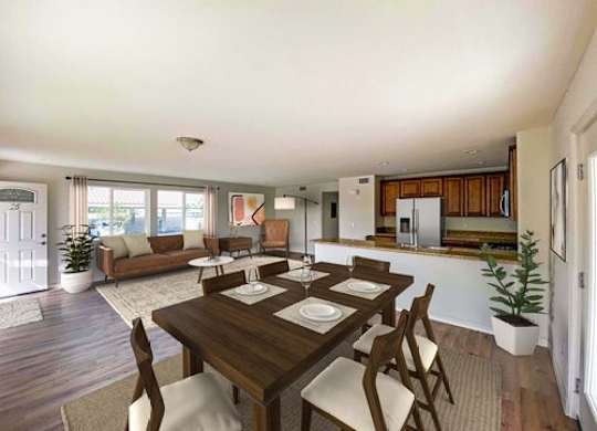 A dining room with a wooden table and chairs.