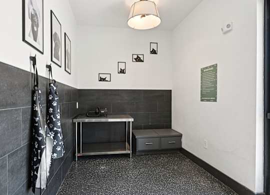A bathroom with a sink and a towel hanging on the wall.