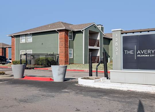 The Avery apartments in Oklahoma City are located in a modern building with a red carpet entrance.