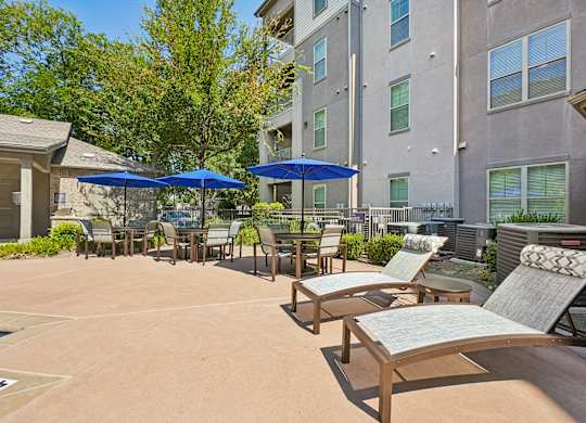 A sunny day at the outdoor seating area of a building.