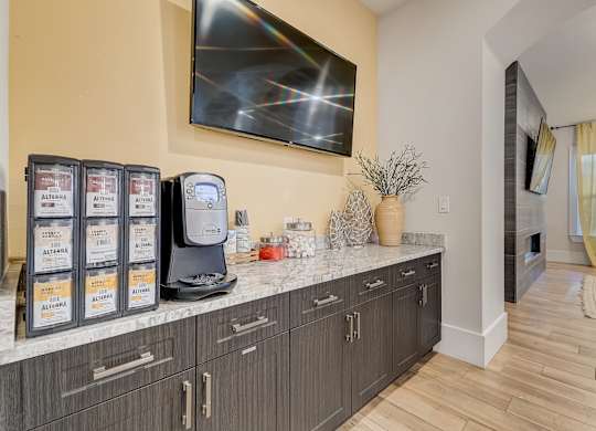 A modern kitchen with a countertop and cabinets.