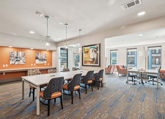 A conference room with a long table and chairs.