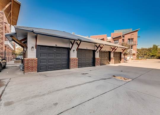 A house with a garage and a driveway in front of it.