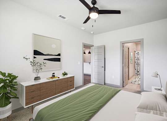 a bedroom with a bed and a ceiling fan