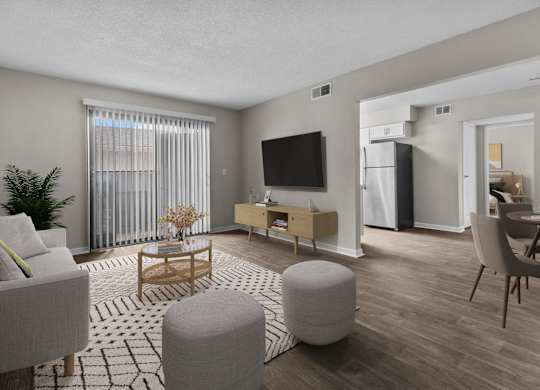 the living room of an apartment with a couch and a table