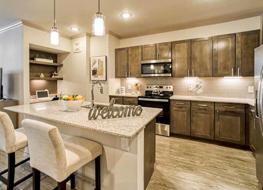 A kitchen with a counter and a sign that says