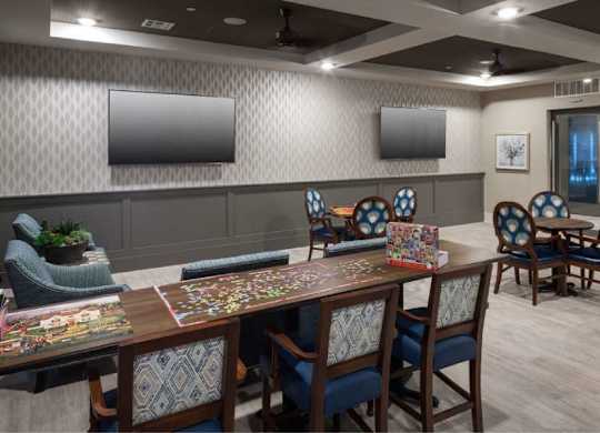 a dining room with a table and chairs