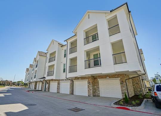 a row of apartment buildings on a city street