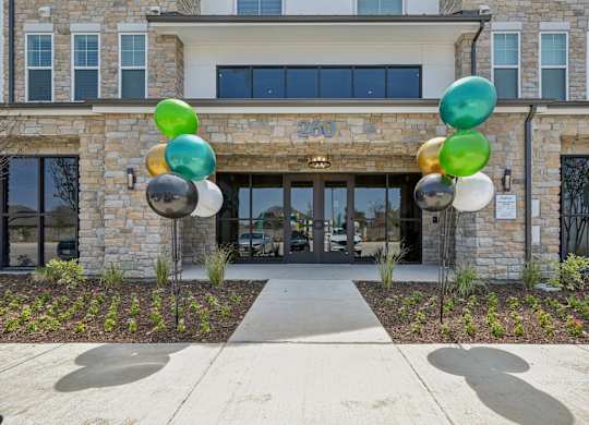 a building with balloons in front of it
