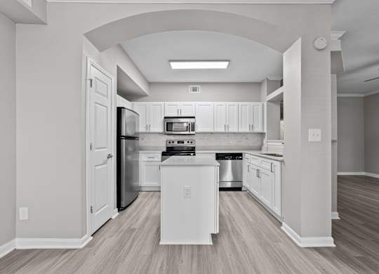 Spacious kitchen at Townhomes of Bent Tree with center island and open layout.