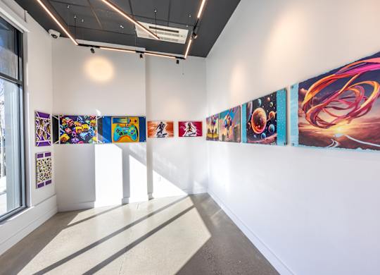 A wall of posters with different designs on them.