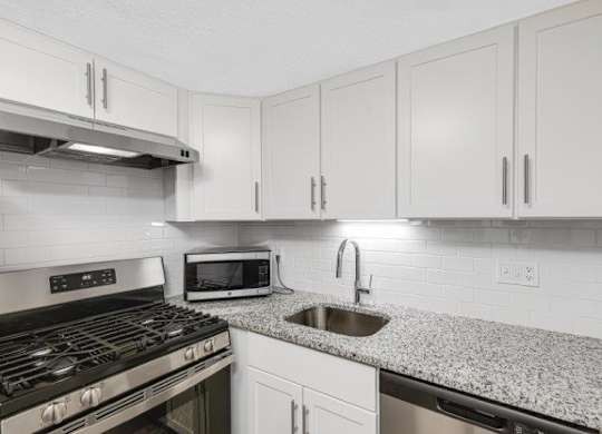 Renovated Kitchen with Granite Countertops & Stainless Steel Appliances