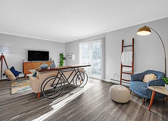 A living room with a bicycle leaning against the wall.