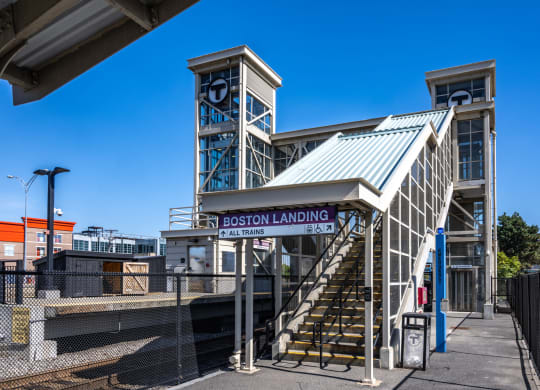 the entrance landing at the Boston Landing commuter rail stopion with stairs