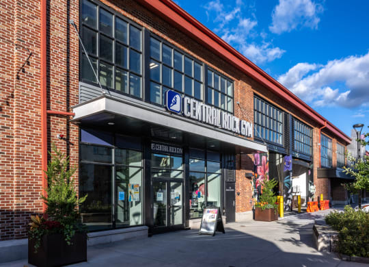 the front of a brick building with a sign that reads central market