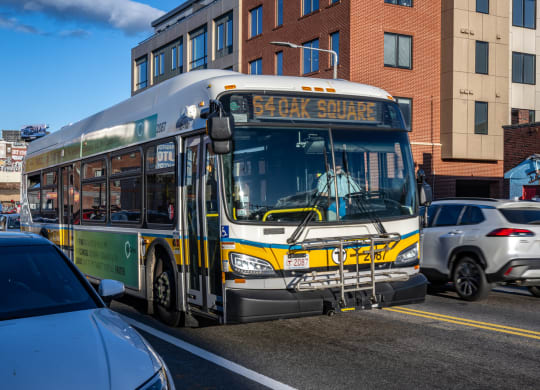 a city bus driving down a busy city street