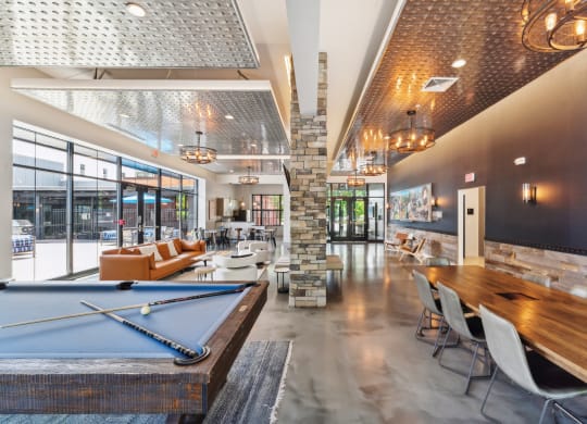 a clubhouse with a pool table and a bar with chairs at The Tannery, Connecticut