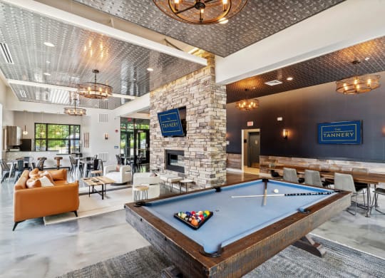 a pool table in the lobby of a club with tables and chairs at The Tannery, Connecticut, 06033