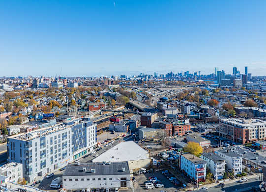 A cityscape with buildings and a clear sky.