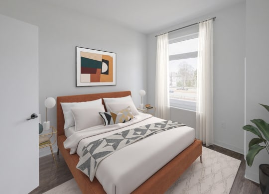a bedroom with a large bed and a window