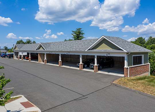 A building with a parking lot in front of it.