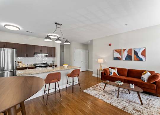 A modern kitchen with a dining table and chairs.